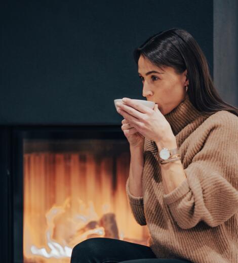 drinking tea by the fireplace